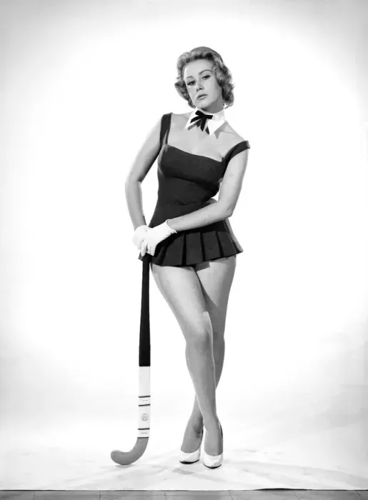 Framed Print : Rita Royce modelling sports kit with hockey stick. Circa 1959 Framed Print : Rita Royce modelling sports kit with hockey stick. Circa 1959