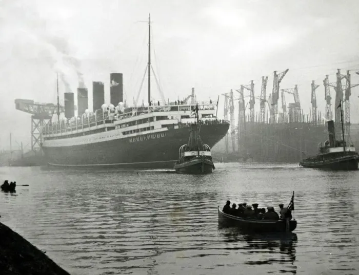 Framed Print : RMS Aquitania seen here being towed away from the John Brown shipyard on the River Clyde Framed Print : RMS Aquitania seen here being towed away from the John Brown shipyard on the River Clyde