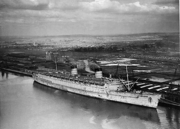 RMS Queen Elizabeth seen here lying againt berth 101 in Greenock at the John Brown