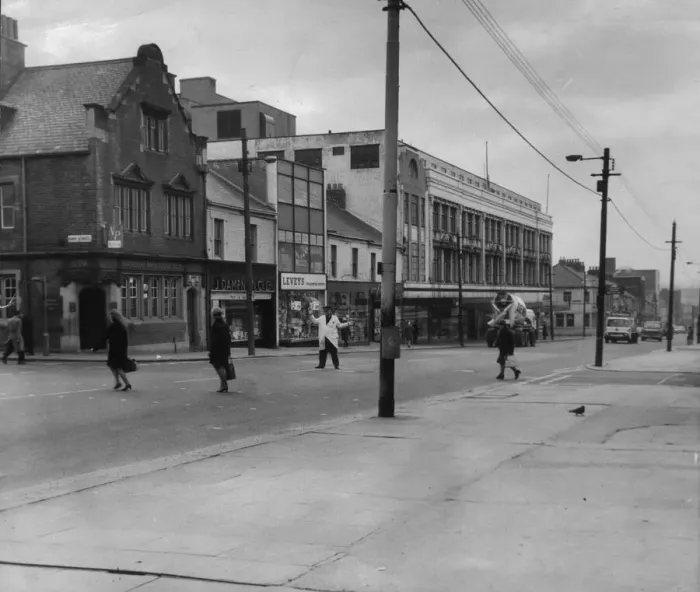 Framed Print : A road crossing patrol man assists people across Shields Road in Byker in 1969 Framed Print : A road crossing patrol man assists people across Shields Road in Byker in 1969