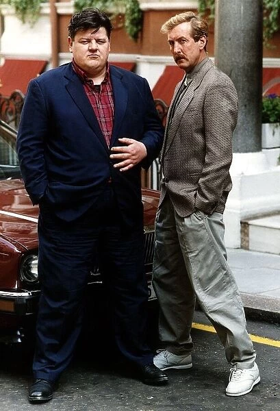 Robbie Coltrane Actor with Eric Idle Actor from 'Nuns on the Run'