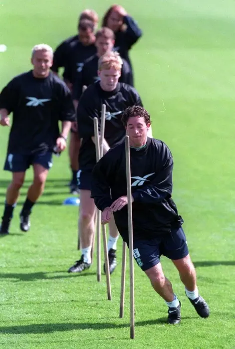 Framed Print : Robbie Fowler leads his teammates during a Liverpool training session Framed Print : Robbie Fowler leads his teammates during a Liverpool training session