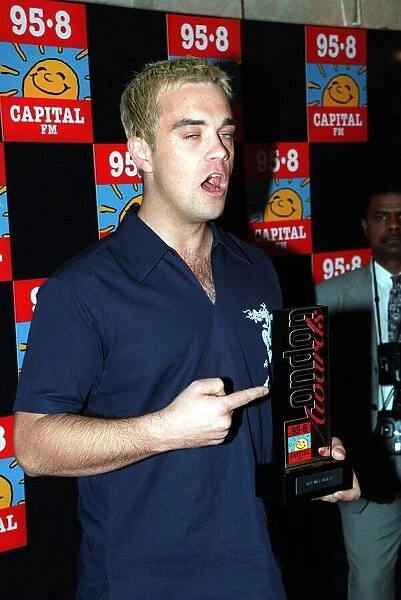 Robbie Williams at Capital Radio Awards April 1998 Holding an award