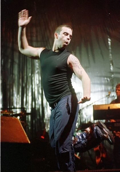 Robbie Williams in concert at Wembley Arena February 1999