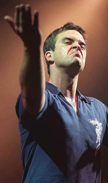 Robbie Williams makes a face to the audience at his concert at the SECC Glasgow February