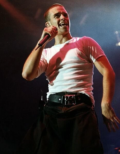 Robbie Williams performing on stage during the the first night concert of Take That at