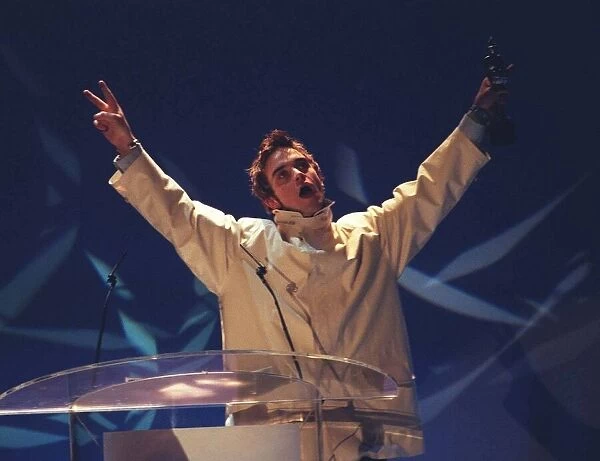 Robbie Williams formerly of Take That presenting an award at the Brit Awards 1996