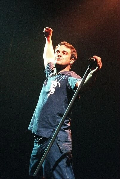 Robbie Williams singer on stage in Glasgow