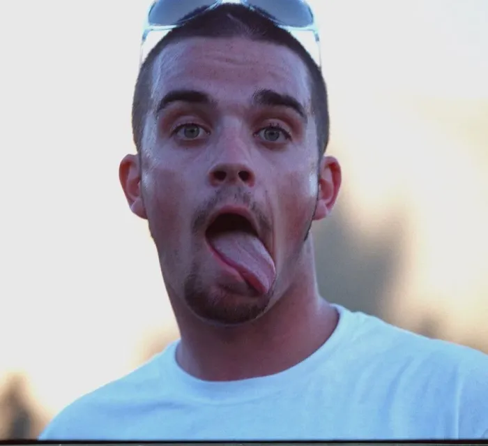 Framed Print : Robbie Williams sticking his tongue out to photographers at T in The Park festival Framed Print : Robbie Williams sticking his tongue out to photographers at T in The Park festival
