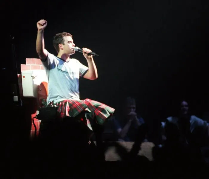Framed Print : Robbie Williams wearing kilt sitting on toilet February 1999 during SECC concert Glasgow