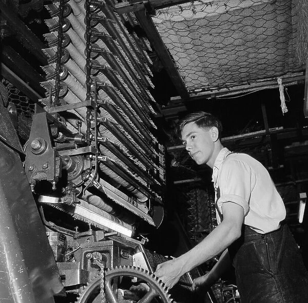 Robert Howarth aged 17 working at Crossleys factory. Halifax in West Yorkshire