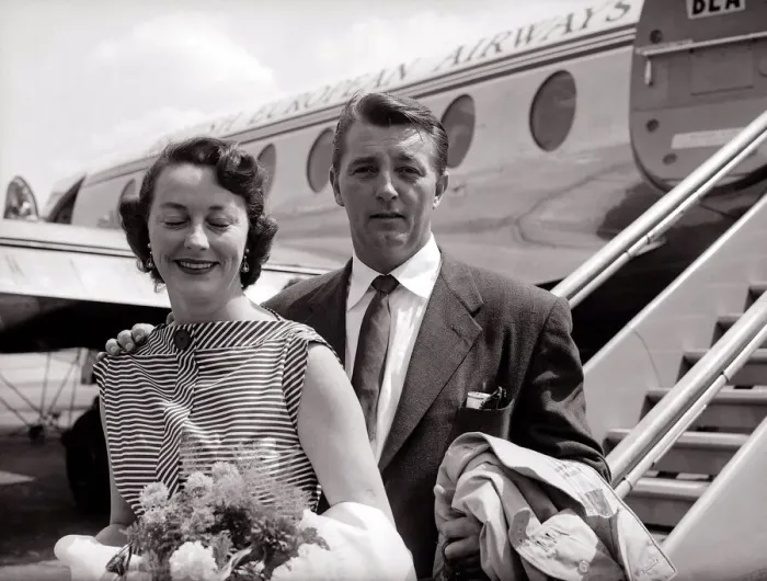 Framed Print : Robert Mitchum and his wife - July 1955 arrive at the London Airport