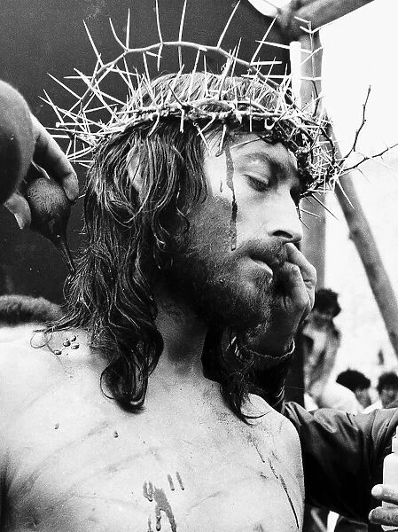 Robert Powell Actor in the role of christ with his crown of thorns during the crucifixion