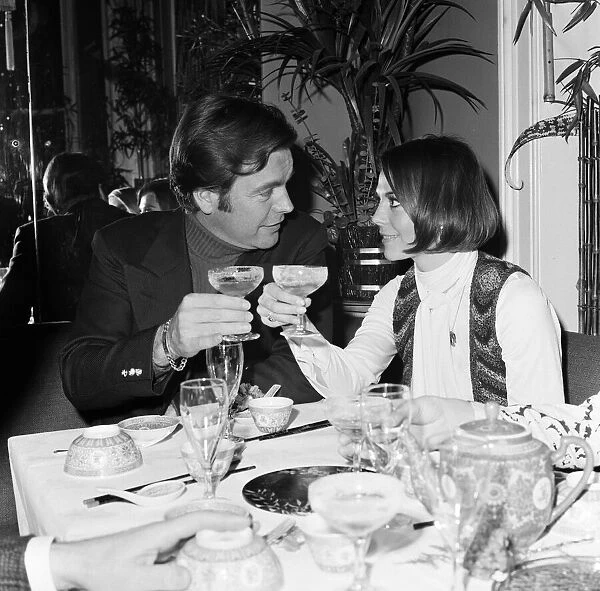 Robert Wagner and wife Natalie Wood drink champagne at the Singing Bamboo Oriental