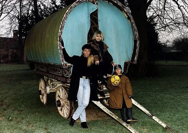 Robin Gibb of the Bee Gees next to gypsy caravan with wife Dwina and their son Robin John