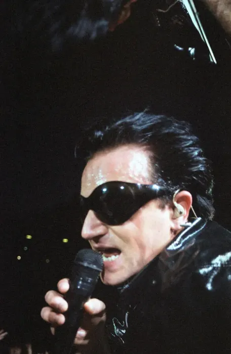Framed Print : Rock group U2 performing on stage at Cardiff Arms Park led by singer Bono