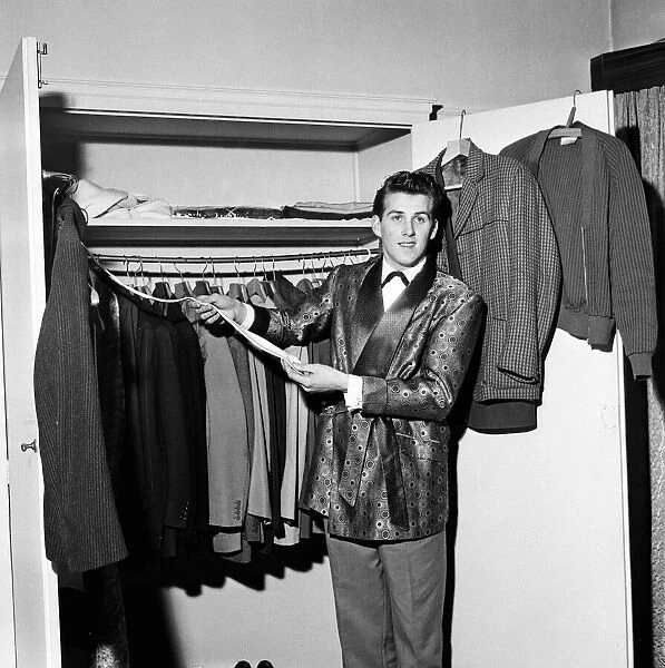 Rock and roll singer Vince Eager shows off his fabulous wardrobe. 5th April 1959