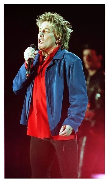 Rod Stewart in concert in Keil Germany December 1998 on stage microphone singing