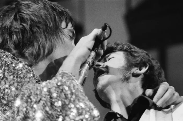 Framed Print : Rod Stewart (left) and bass player Ronnie Lane share the microphone Framed Print : Rod Stewart (left) and bass player Ronnie Lane share the microphone