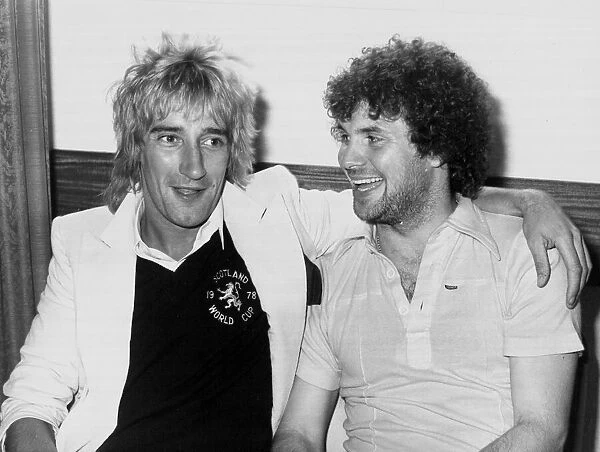 Rod Stewart with striker Derek Johnstone. The pop superstar called in on the Scottish