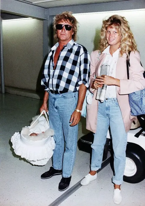 Framed Print : Rod Stewart and Wife Rachel leaves Heathrow Airport Aug 1992 Framed Print : Rod Stewart and Wife Rachel leaves Heathrow Airport Aug 1992