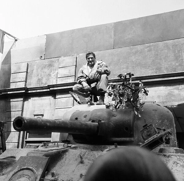 Rod Taylor, on a Sherman tank, on the set of MGMs new film The Liquidator