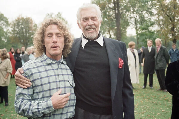 Roger Daltrey, singer of British rock group The Who, pictured with actor James Coburn at