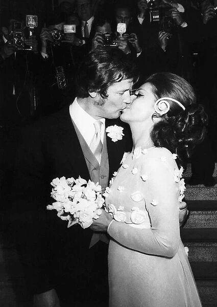 Roger Moore Actor and bride Luisa at wedding reception - Royal Garden Hotel London