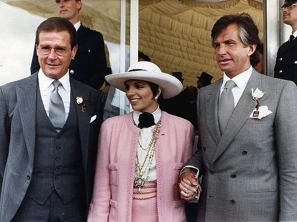 Roger Moore Actor James Bond with and George Hamilton at the Epsom Derby