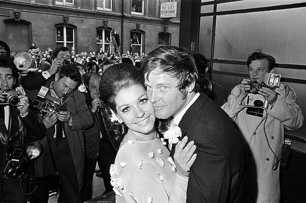 Roger Moore Actor and third wife Luisa Mattiolli Actress at Caxton Hall after wedding