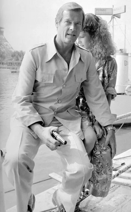 Framed Print : Roger Moore with actress Lois Chiles at a photocall and reception held in Paris to