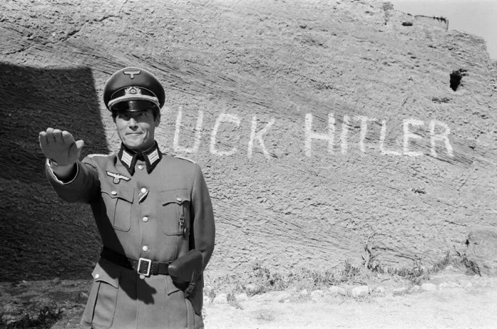 Framed Print : Roger Moore on the set of Escape to Athena in Rhodes, Greece. 8th March 1978 Framed Print : Roger Moore on the set of Escape to Athena in Rhodes, Greece. 8th March 1978