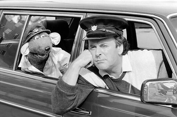 Roland rat being welcomed to the BBC by driver and chat show host Terry Wogan