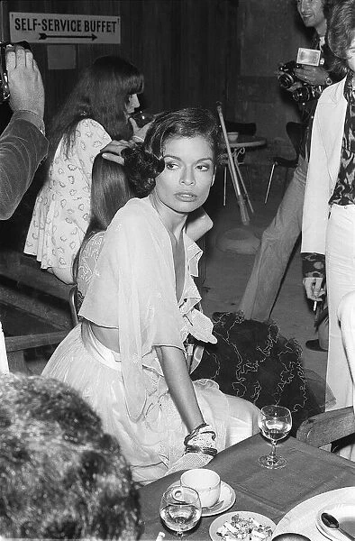 Rolling Stones. Bianca Jagger wife of Mick Jagger, with Bill Wyman in the background at