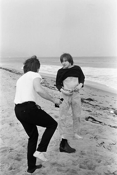 The Rolling Stones. Charlie Watts and Brian Jones seen here posing on Malibu beach