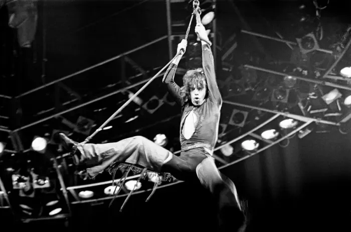 Framed Print : Rolling Stones Concert, Stones singer Mick Jagger swings high in the air during a concert Framed Print : Rolling Stones Concert, Stones singer Mick Jagger swings high in the air during a concert