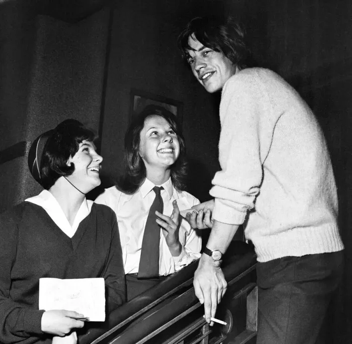 Framed Print : Rolling Stones fans Alison Anderson and Elizabeth Sayers seen here with Lead singer Mick