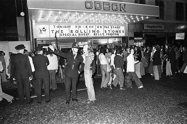 Rolling Stones fans queue outside the Odeon, New Street, Birmingham before the concert