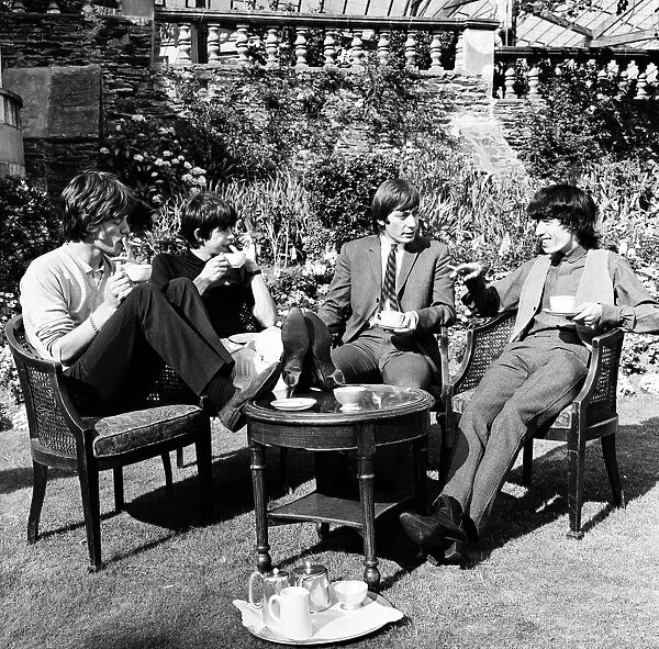 The Rolling Stones having a cup of tea in their hotel garden at Douglas