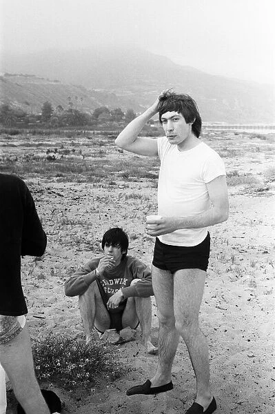 The Rolling Stones. Keith Richards and Charlie Watts seen here posing on Malibu beach