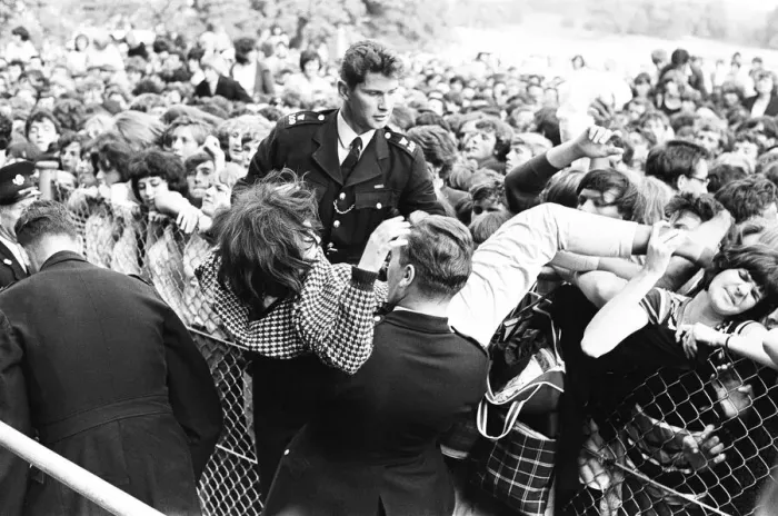 Framed Print : The Rolling Stones at Longleat, home of Lord Bath. Fainting girl fans are carried Framed Print : The Rolling Stones at Longleat, home of Lord Bath. Fainting girl fans are carried