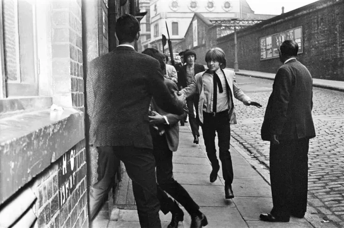 Framed Print : The Rolling Stones make a dash for the stage door while police keep the fans at bay Framed Print : The Rolling Stones make a dash for the stage door while police keep the fans at bay
