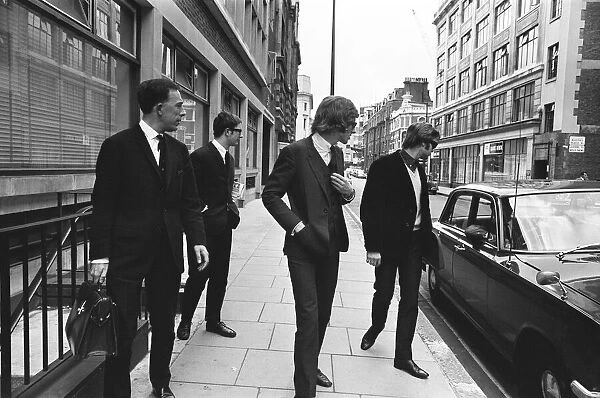 The Rolling Stones manager Andrew Loog Oldham (centre) on his way to Wells Street Court