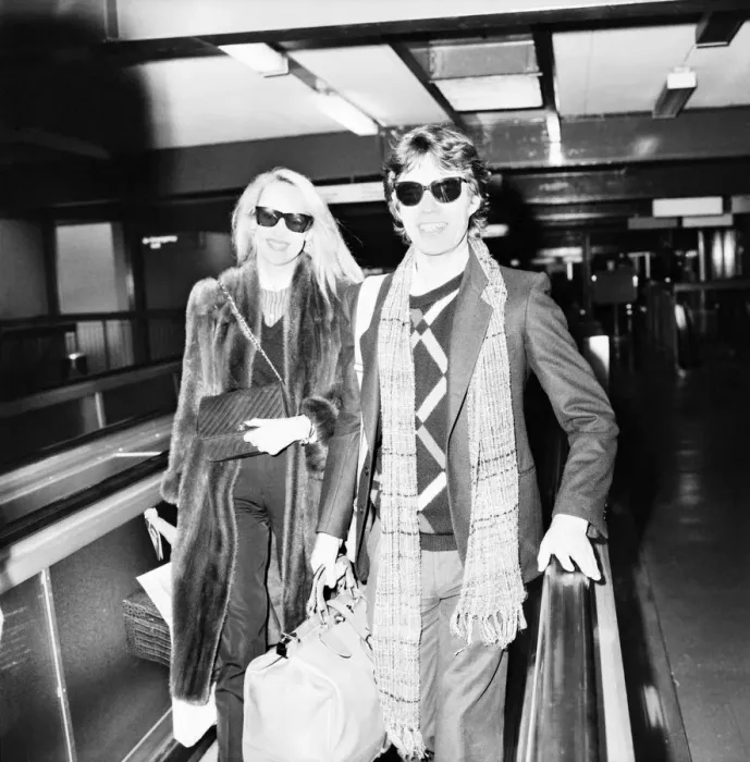 Framed Print : Rolling Stones. Mick Jagger and Jerry Hall leaving London Airport Heathrow for a