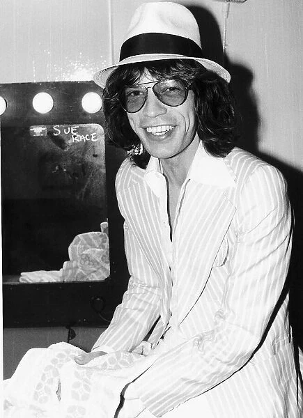 Rolling Stones: Mick Jagger relaxing in his dressing room before a concert May 1976