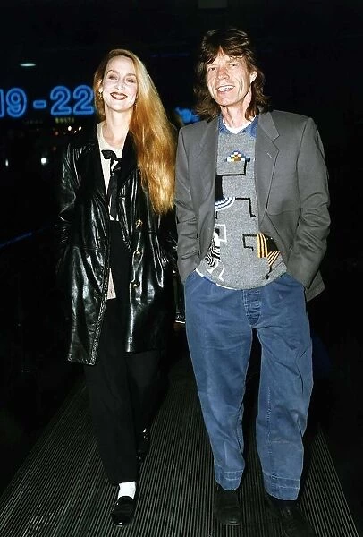 Rolling Stones: Mick Jagger walks with wife actress model Jerry Hall in 1993