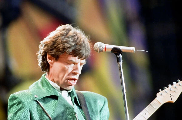 The Rolling Stones performing at Wembley Stadium with lead singer Mick Jagger on stage
