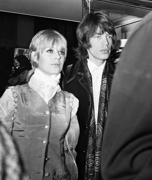 Rolling Stones pop group lead singer Mick Jagger, pictured with girlfriend Marianne