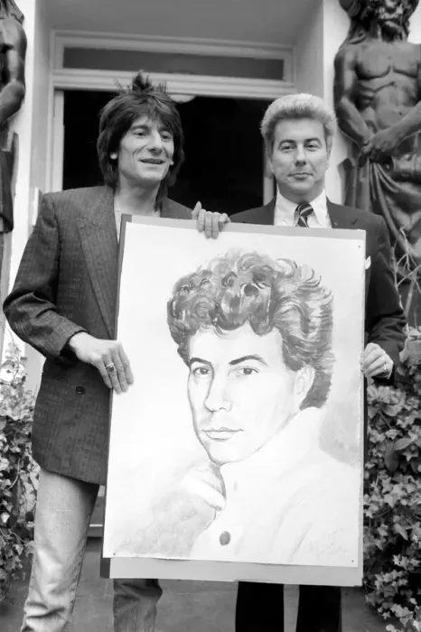 Framed Print : Rolling Stones: Ronnie Wood holds a painting of author Ken Follett who stands next to him Framed Print : Rolling Stones: Ronnie Wood holds a painting of author Ken Follett who stands next to him