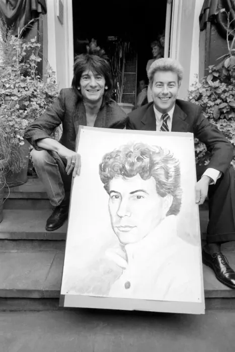 Framed Print : Rolling Stones: Ronnie Wood holds a painting of author Ken Follett who stands next to him Framed Print : Rolling Stones: Ronnie Wood holds a painting of author Ken Follett who stands next to him
